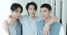 three young men are posing for a picture together
