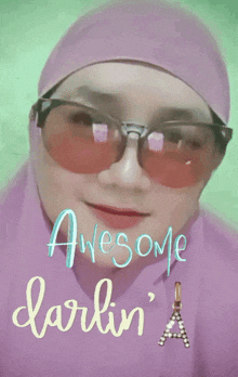 a woman wearing sunglasses and a hijab says awesome darlin '