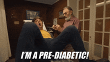 a man laying on his stomach with the words " i 'm a pre-diabetic " on the bottom