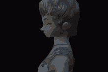 a statue of a woman with white eyes and a blue necklace
