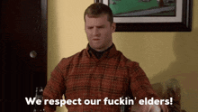 a man in a plaid shirt says we respect our fuckin elders