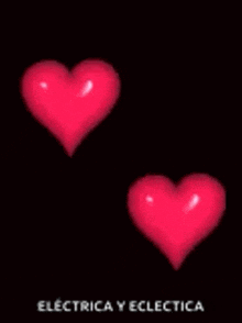 two red hearts are being struck by lightning on a black background .