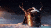 a helmet with horns is sitting in the snow .