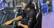 a man wearing headphones and a black shirt that says iambrandon on it