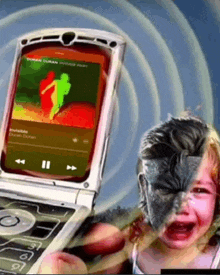 a child is crying in front of a flip phone that says invisible