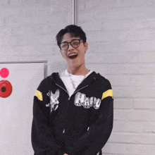 a man wearing glasses and a hoodie that says halo on it