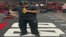 a man in a black shirt that says rage ear on it