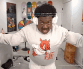 a man wearing a shirt with a pig on it