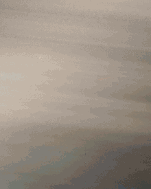a blurry picture of a person 's face with a blue line