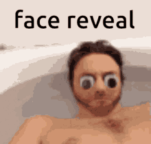 a man is laying in a bathtub with googly eyes on his face and the words face reveal above him