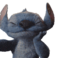 a stuffed animal with its eyes closed looks like stitch