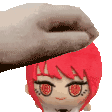 a hand is putting a stuffed animal on top of a stuffed animal with red hair .