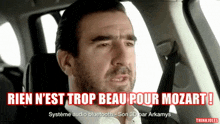 a man in a car with the words rien n'est trop beau pour mozart written above him