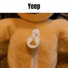 a stuffed animal with a needle in its chest that says yeep on it