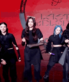 a group of women are dancing together on a stage .