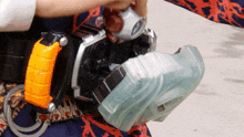 a person is wearing a belt with a clear item that looks like a wallet