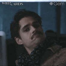 a man with a mustache has the words that was very convincing written on his face