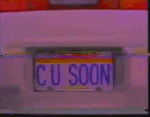 a close up of a license plate that says cu soon