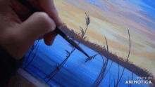 a person is painting a landscape with the words made in animotica