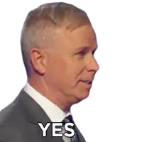 a man in a suit and tie has the word yes on his face