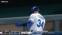 a baseball player with the number 34 on the back of his shirt