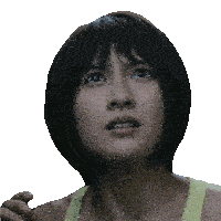 a close up of a woman 's face with a surprised expression