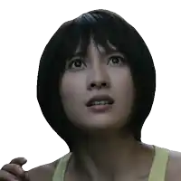 a close up of a woman 's face with a surprised expression