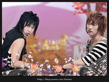 two young men are sitting in front of flowers and a starnews logo