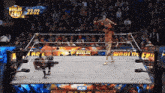 two wrestlers in a wrestling ring with the words world end on the screen