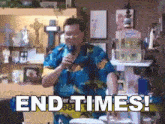 a man singing into a microphone with the words end times written below him