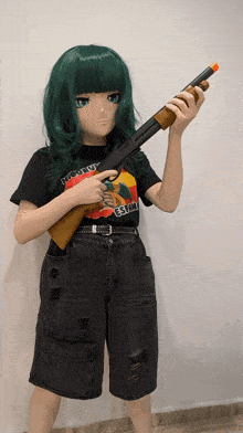 a girl with green hair is holding a shotgun and wearing a shirt that says ' freedom ' on it