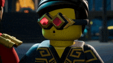a lego character wearing goggles with red lenses