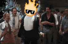 a man in a tuxedo with a flaming head wearing sunglasses with the letter f on it