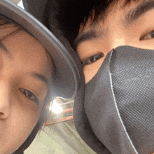 a woman wearing a hat and a man wearing a face mask