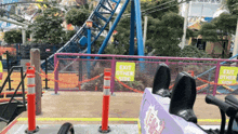 a roller coaster with a sign that says " exit other side "