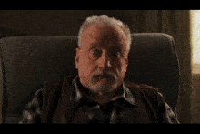 a man sitting in a chair with the words " i was awake dammit " on the bottom