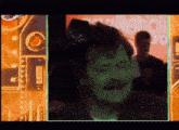 a man with a green face is in front of a sign that says stakeholders