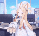 a girl with long blonde hair and ears is standing in front of a computer desk .