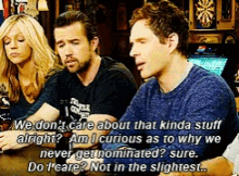 a group of people are sitting at a table and one of them is saying we don t care about that kinda stuff alright