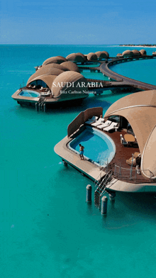 an advertisement for saudi arabia shows a man standing next to a swimming pool