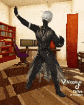 a man in a black outfit is dancing in a room with a computer on the wall