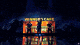 a woman stands on a stage in front of a sign that says winners cafe