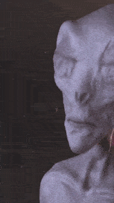 a close up of an alien 's face with glowing eyes and the letter r on it