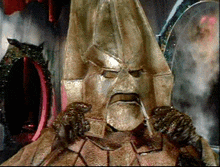a statue of a man with a beard and a mask on his face