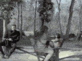 a man and a woman are sitting on a merry go round in a park