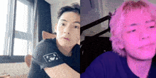 a man in a black shirt and a man with pink hair are sitting next to each other .