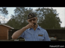a man in a police uniform has the word polis on his collar