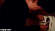 a close up of a person shaving their face with a razor and a beard .
