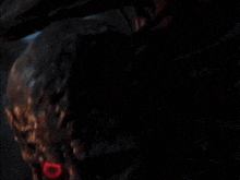 a close up of a zombie with red eyes