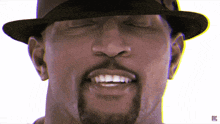 a close up of a man wearing a hat with the letter z on the bottom